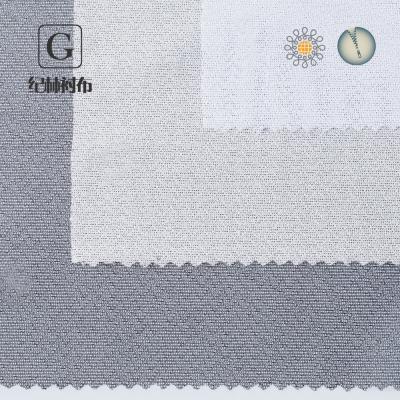 China High Quality Adhesive 100% Polyester Tube Jacquard Circular Knitting Fusible Interlining for sale