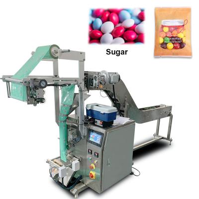 China Vertical Food Volume Cup Weighing Melon Seeds Sugar Dried Small Granule Toy Food Packaging Machine for sale