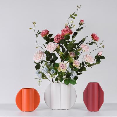 China Custom Creative High Quality Minimalist Irregular Shape White Ceramic Flower Vases Supply Items For Living Room Office Home Decor for sale