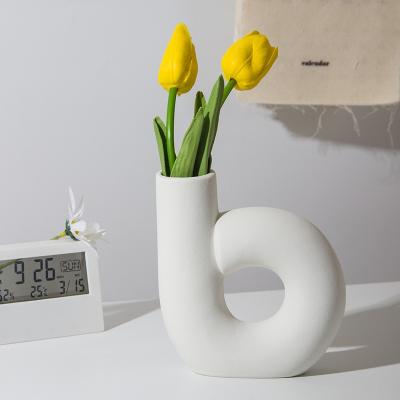 China Minimalist Luxury Home Ornaments Irregular Shaped Modern White Ceramic Flower Pot Table Decoration Porcelain Vase For Living Room Home Decor for sale