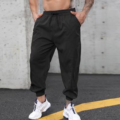 China BOBOYU Windproof Drop Shipping Sports Sweatpants Jogger Pants Elastic Trousers Men Harem Wear Casual Loose Pants for sale