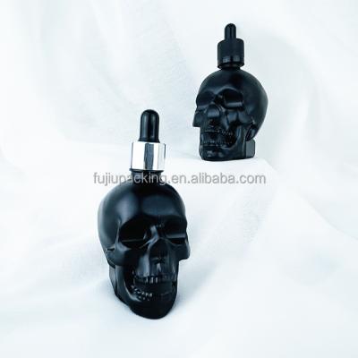 China Wholesale Essential Oil Packaging Bottle Skull Shape Glass Bottles Glass Dropper Bottle for sale