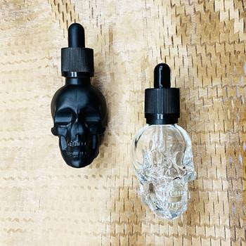 China Black Essential Oil Free Glass Clear Skull Dropper Bottle 30ml 60ml 120ml Skull Sample Dropper Glass Bottle for sale