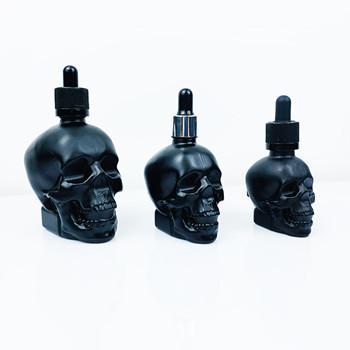 China High Quality Black Skull Essential Oil Clear 30ml 60ml 120ml Dropper Glass Bottle With Child Proof Dropper for sale