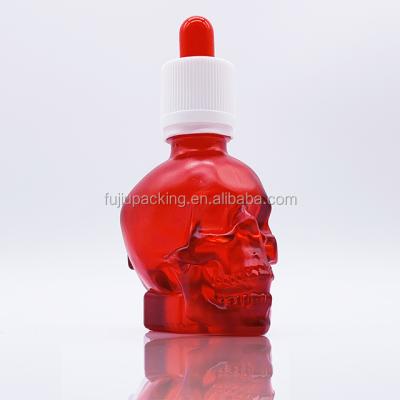 China Essential Oil 30ml Color Red Skull Glass Dropper Bottle With Dropper Bottle for sale