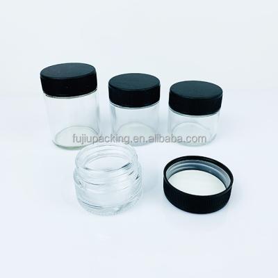 China Food grade cosmetic glass jar with lids plastic cbd cream glass jar with lids plastic food storage jar for sale