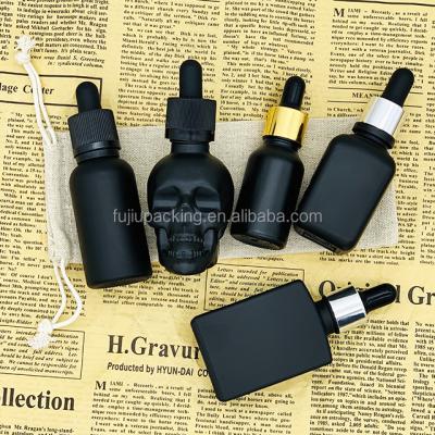 China eco-friendly black essential oil bottles glass dropper bottle 30ml for cbd oil for sale