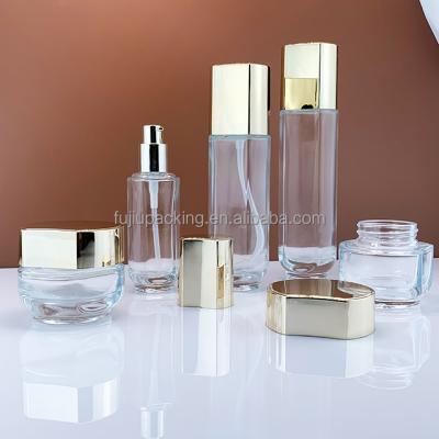 China Luxury Cosmetics Packaging Glass Bottle Sets Empty Cream Jar And Pump Spray Bottle Skin Care Set Face Cream Lotion Glass Bottle for sale