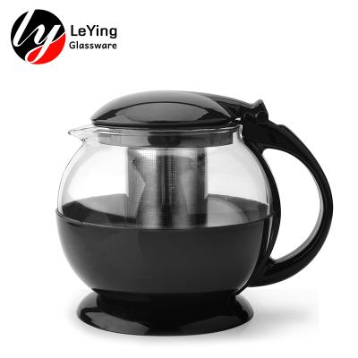 China Sustainable Eco - Friendly Round Shape Transparent Glass Teapot With Plastic Handle And Lid for sale