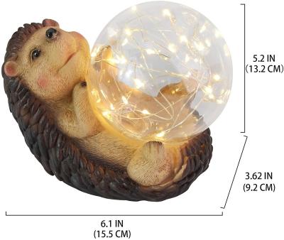 China Solar Hedgehog Resin Dog Garden Statue Lights Solar Animal Figurine Solar Garden Light Outdoor Decorative Statues for sale