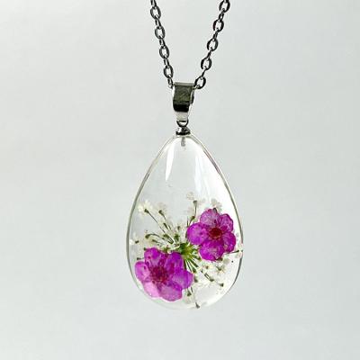 China Cute Ivy New Design Tear Drop Necklace Narcissus Flower Pendants Resin Dried Flower Charms for sale