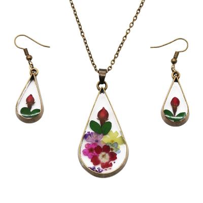 China 2022 CLASSIC Fashion Jewelry Set With Rose Bud Real Dry Flower Jewelry Set Wholesale for sale