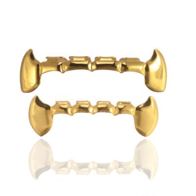 China Hot Selling Custom Hiphop Hip Hop Fit Hollow Out Gold Teeth Grillz Fangs Upper and Lower Set Bling Free Teeth Grillz for sale