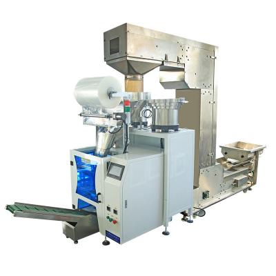 China High Efficiency Grains Granules Hardware Screw Counting Packing Machine With Vibration Feeder Drum for sale