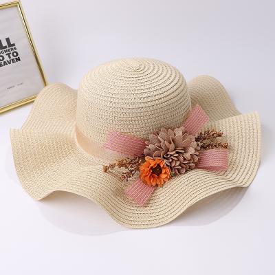 China High Quality Seaside Beach Sun Shade Striped Natural Straw Straw Hats With Flower for sale