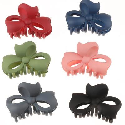 China For Hair Styling For Hair Styling Fashion Hair Accessories Matte Colorful Bowknot Claw Clip Customization For Woman Hollow Out Plastic Hair Claw For Girls for sale