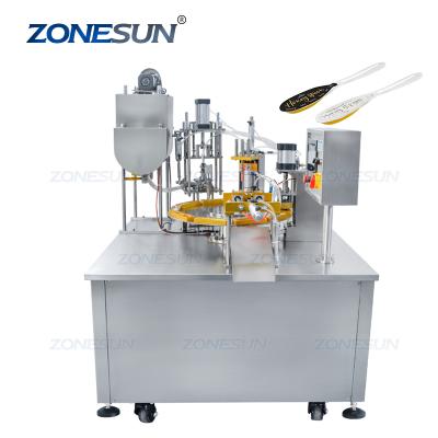 China Automatic Liquid Filling and Sealing Machine Honey Packaging Machine Honey Spoon Monoblock Rotary Paste Single Head Food ZONESUN for sale