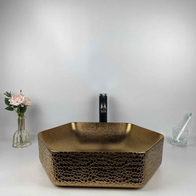 China Modern High Quality Round Wash Sink Gold Color Round Lavabo Countertop Ceramic Hexagonal Bathroom Sink for sale