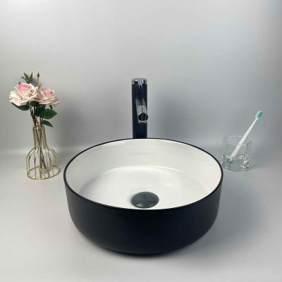 China Matte Black White Modern Ceramic Art Hand Wash Basin Vessel Bathroom Sink Countertop Modern Wash Basin for sale