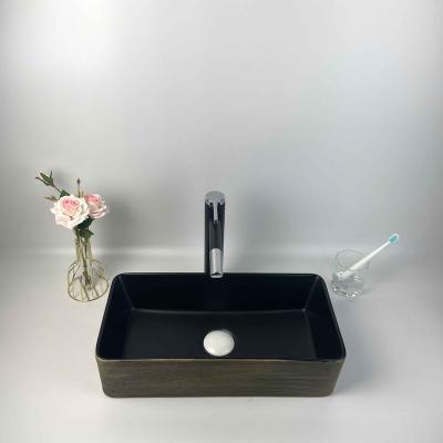 China Modern Design Special Elegant Rectangular Countertop Ceramic Hand Wash Basin For Bathroom for sale