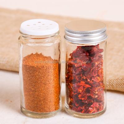 China Sustainable Round Pepper Kitchen Use 100ml Glass Spice Jar With Metal Lids for sale