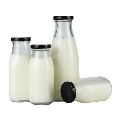 China 200ml 250ml 300ml 500ml Recycled Flint Clear Milk Juice Glass Empty Bottle With Screw Metal Lids for sale