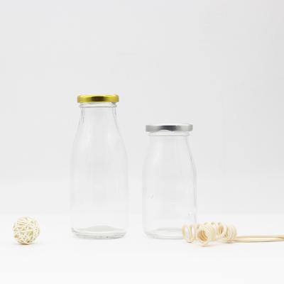 China Drinking 270ml clear unique fresh milk glass bottles wholesale soy glass milk bottle with metal lid supply for sale