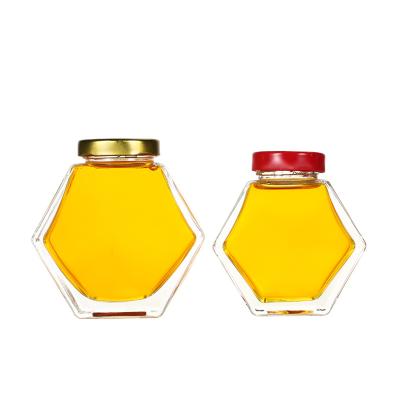 China Healthy Hexagon Glass Jars For Honey 100ml 180ml 280ml 380ml With Metal Lid for sale