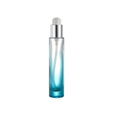 China Fashionable 1Oz Gradient Base Luxury Glass Bottle With Aluminum Lotion Pump for sale