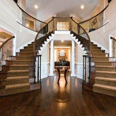 China Double Curved Contemporary Duplex Staircase Modern Wrought Iron Railing Design for sale