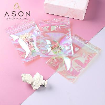 China Jewelery Packaging Spot Rainbow Film Laser Bag Self-Sealing Magic Color Color Jewelry Packaging Plastic Sealing Sealing Bag for sale