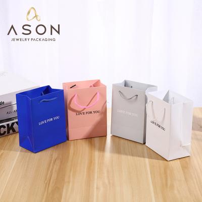 China Wholesale High Quality Stain Jewelry Packaging Bag Paper Coated Paper Bag Can Be Customized Logo Gift Bag for sale