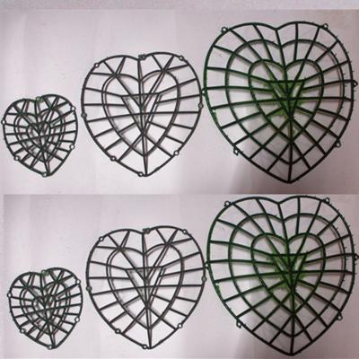 China Heart shape artificial flowers flower background silk flower arrangement plastic decorative frame for sale