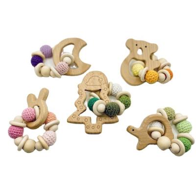 China Soft Toy Baby Teether Teething New Bead Knitted Bracelet Teether Baby Crochet Rattle Relief Design DIY Wooden Chewing Toy for sale