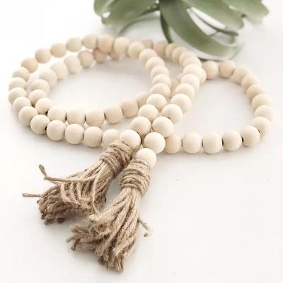 China Large Environmental Friendly Wooden Bead Garland With Tassels Christmas Wood Crafts Decorations For Home Decor Wood for sale