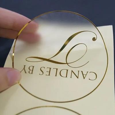 China Waterproof NO MOQ Customized Printing Clear Gold Foil Stickers Self Adhesive Transparent Label With Logo for sale