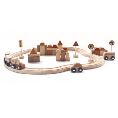 China Eco-friendly building block material luxury wooden railway set toy train slot machine diy railway toy for sale