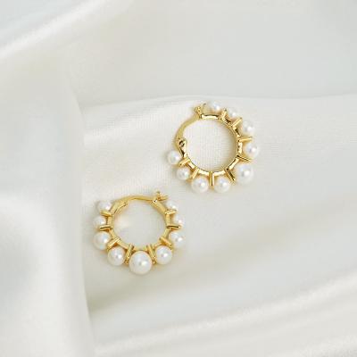 China Trendy Exquisite Sunflower Pearl Earrings Women Luxury Gold Plated Pearl Huggie Earrings TRENDY for sale