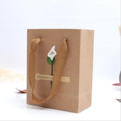 China Custom Custom Large Kraft Paper Bag Clothing Paper Bag Spot Customized Gift Bag Wholesale for sale