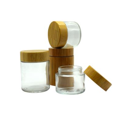 China 3.5g Glass Lid Cosmetic Bamboo Wooden Resistant Flower Child Jar Custom Packaging Airtight Glass 2Oz 4oz Logo Printing for sale