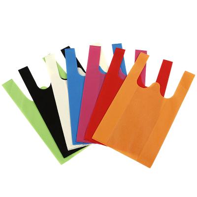 China 100% Eco-friendly Wholesale Colorful W Cut Non Woven Non Woven Vest T Shirt Bags for sale