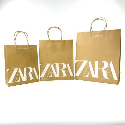 China Biodegradable luxury hot sales kraft paper bag handle recyclable paper bags printed exclusive logo for sale