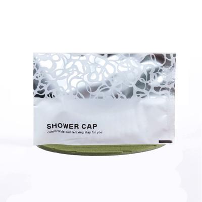 China Home Spa Hotel Consumables PE ISO9001 ROHS Displacement Independent Packaging Degradable Plastic Disposable Shower Caps for sale