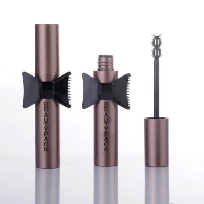 China Cosmetics wholesale brown matte color empty plastic mascara tube container with bowknot for sale