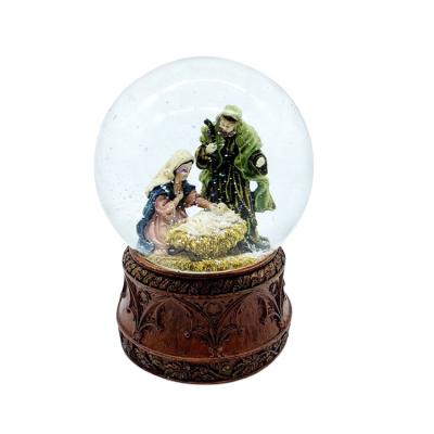 China Wholesale Nativity Primitive Religious Manger Resin Craft Decor 120MM Europe Christmas Snow Glass Globes for sale