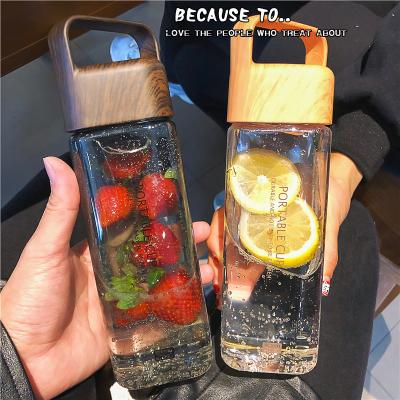 China 2022 summer new sustainable portable plastic leakproof bpa free drinking water bottle 600ml square bottles with handle for sale