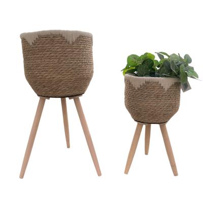 China CLASSIC Sea Grass Wicker Basket With Wooden Legs For Flower Planter Pots for sale