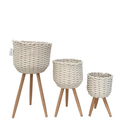 China CLASSIC Flower Basket Wicker Planter With Knock Down Wood Legs For Flowers Pots for sale