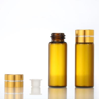 China Cosmestic Factory Supply Screw Bottle Essential Oil Bottle Glass Amber Vials With Gold Cap for sale