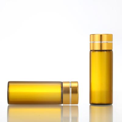 China Amber Glass Cosmetic Screw Bottle Essential Oil Bottle Vials With Gold Cap for sale